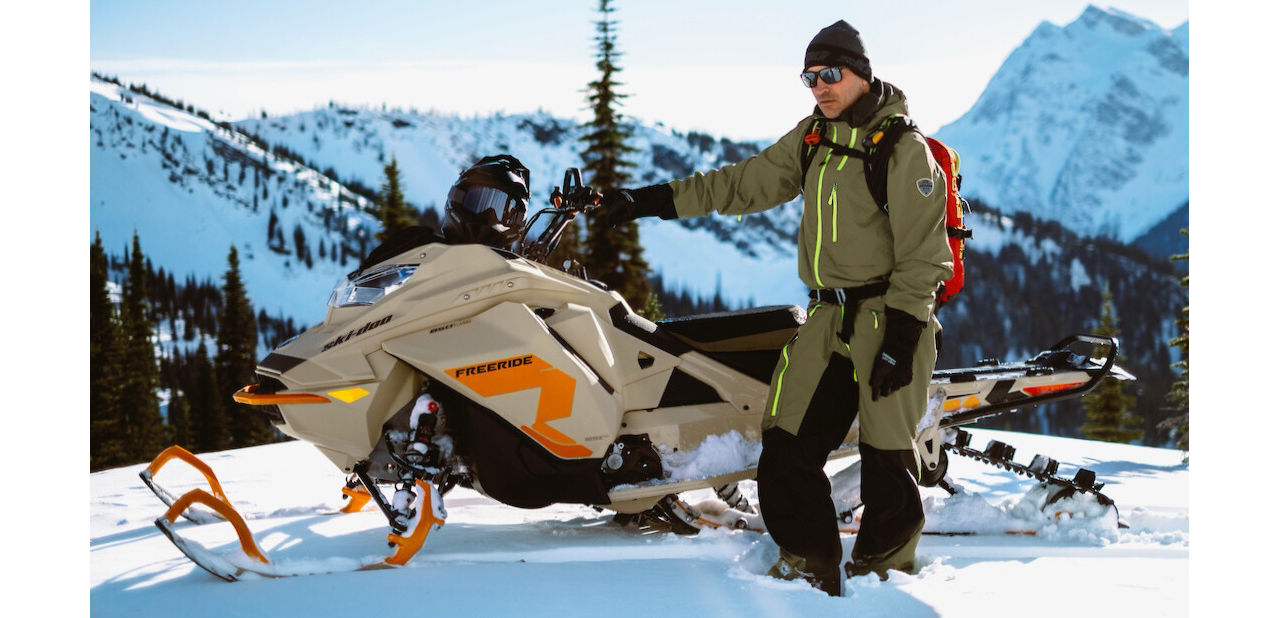 hero shot of a ski doo rider on a mountain ridge