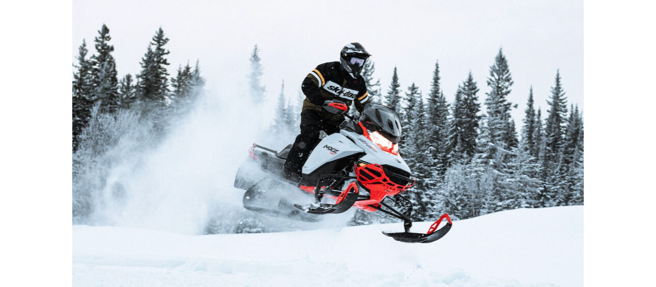 hitting a jump of a ski doo