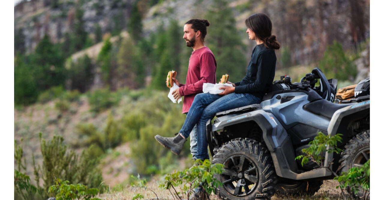 couple enjoying lunch on a can am atv