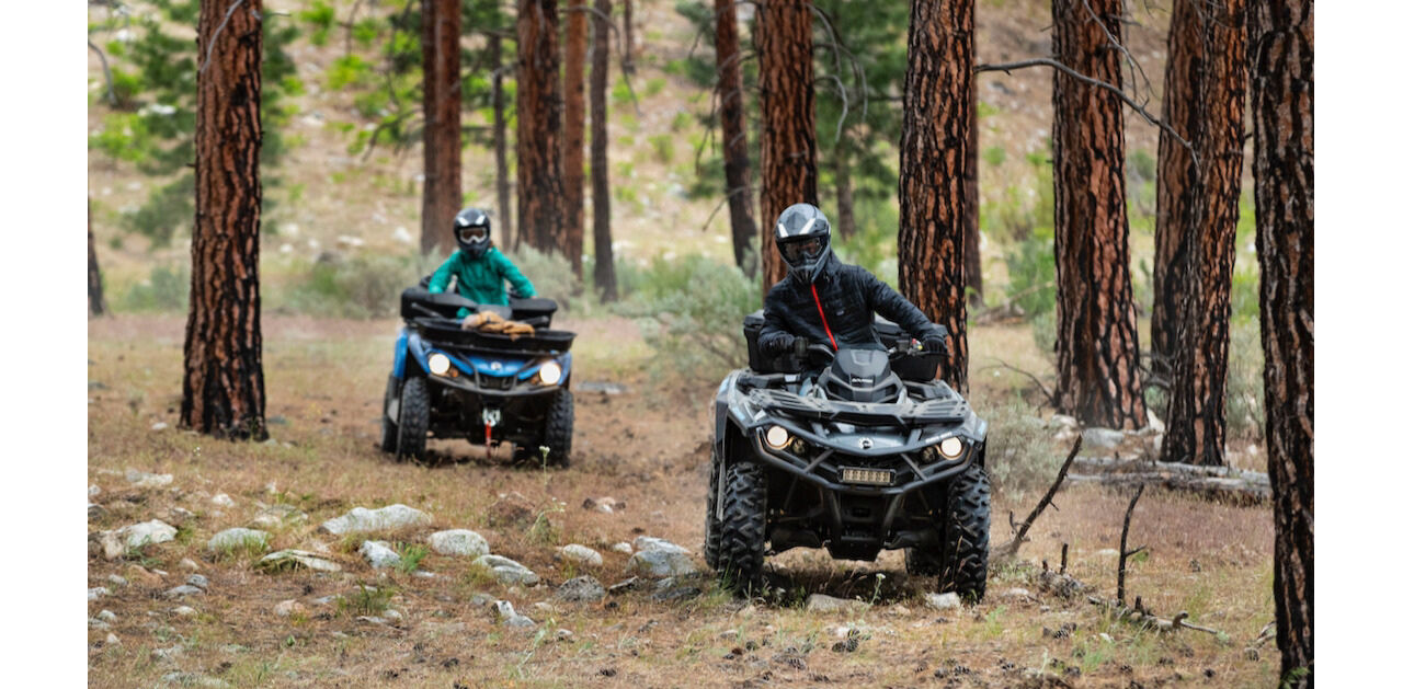 couple on a forest atv ride