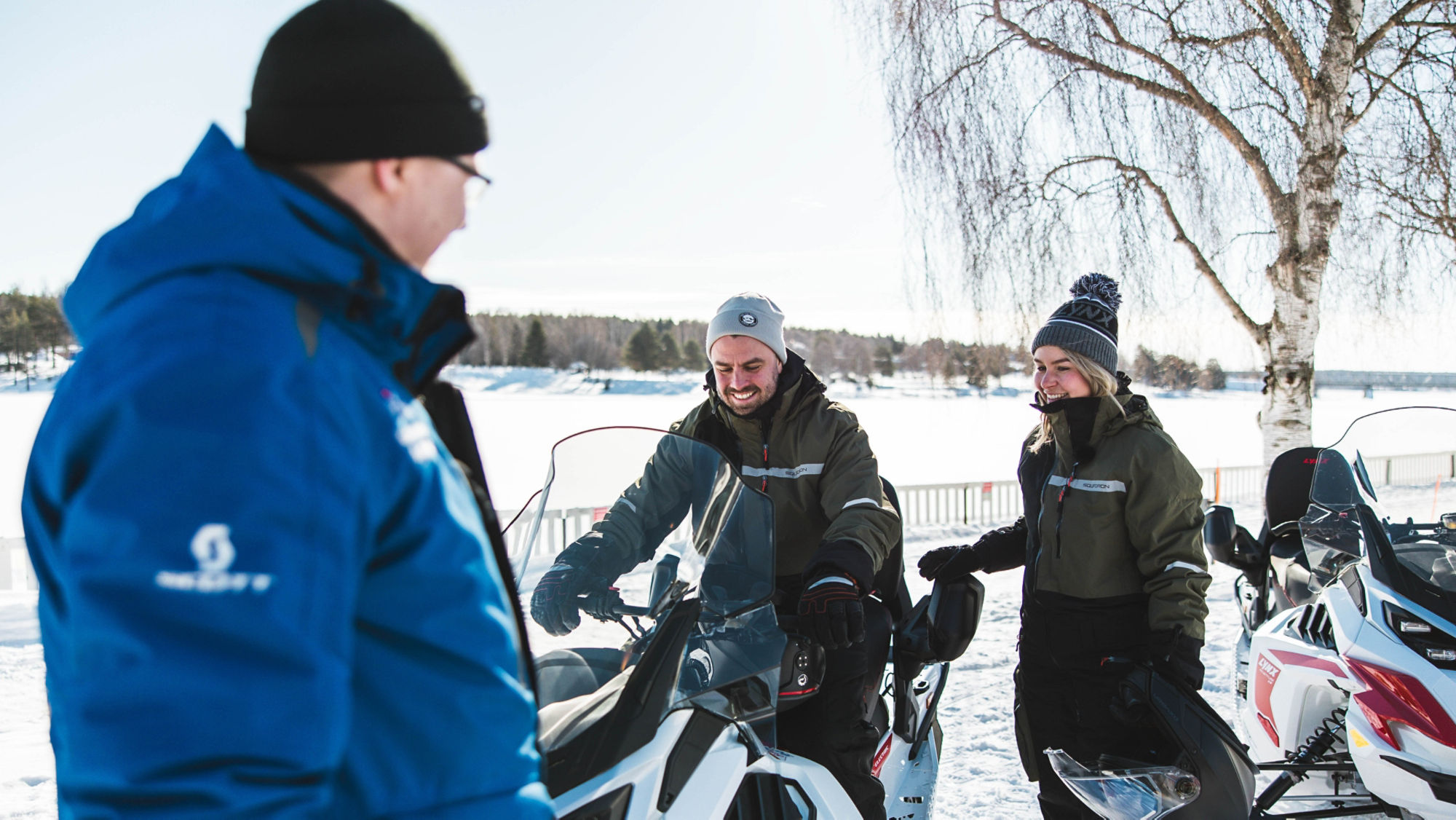 Three Lynx snowmobile riders in Lapland