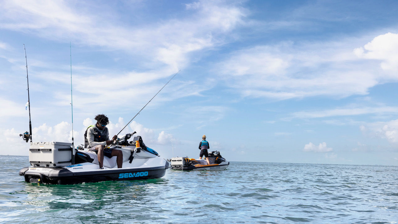 Two people fishing on their Sea-Doo FishPro personal watercraft